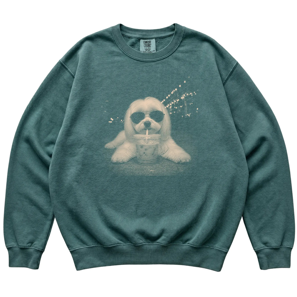 Maltese wearing aviator sunglasses and drinking iced coffee on a Blue Spruce Comfort Colors 1566 Sweatshirt, flat lay view