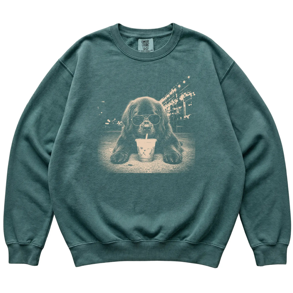 Newfie wearing aviator sunglasses and drinking iced coffee on a Blue Spruce Comfort Colors 1566 Sweatshirt, flat lay view