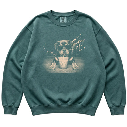Rottweiler wearing aviator sunglasses and drinking iced coffee on a Blue Spruce Comfort Colors 1566 Sweatshirt, flat lay view