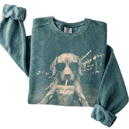 Vizsla wearing aviator sunglasses and drinking iced coffee on a Blue Spruce Comfort Colors 1566 Sweatshirt, folded view