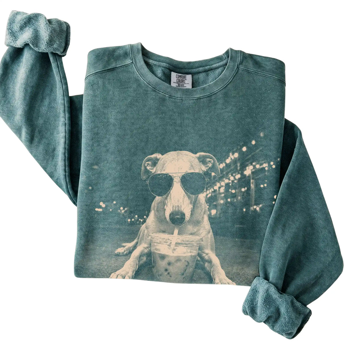 Whippet wearing aviator sunglasses and drinking iced coffee on a Blue Spruce Comfort Colors 1566 Sweatshirt, folded view