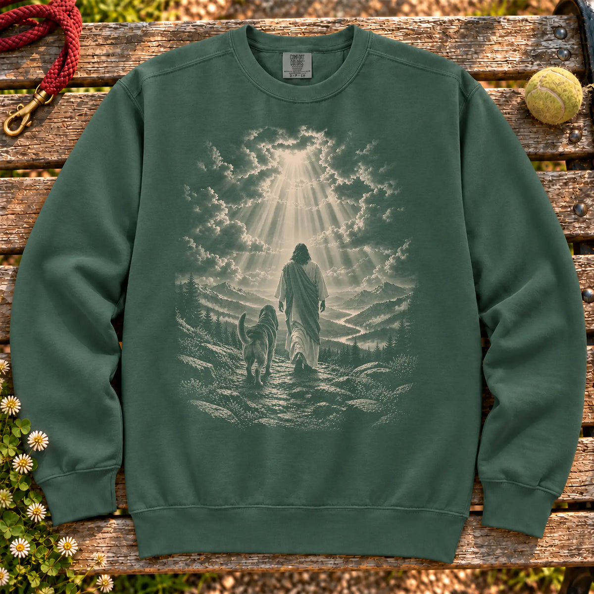Blue Spruce sweatshirt showing Jesus walking beside a Bloodhound beneath rays of light