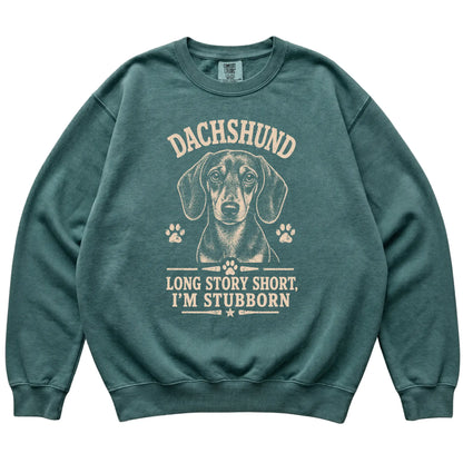 Blue Spruce Comfort Colors® sweatshirt featuring Long Story Short, I'm Stubborn - Dachshund, laid-flat presentation