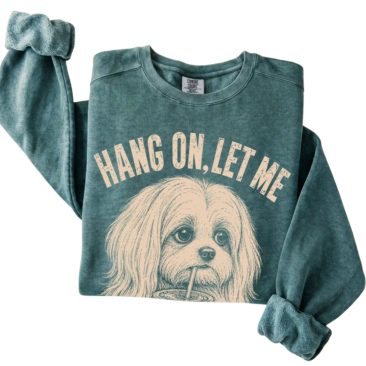 Blue Spruce Comfort Colors sweatshirt featuring Maltese Iced Coffee Overthink, folded presentation