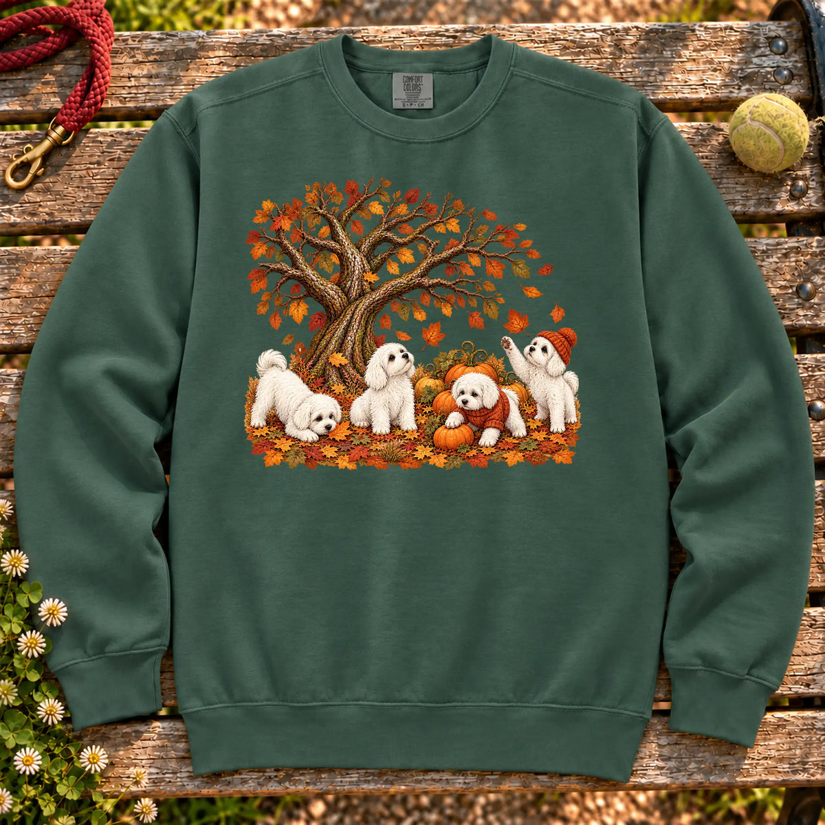 Four Maltese puppies with pumpkins beneath an autumn tree on a Blue Spruce garment-dyed sweatshirt