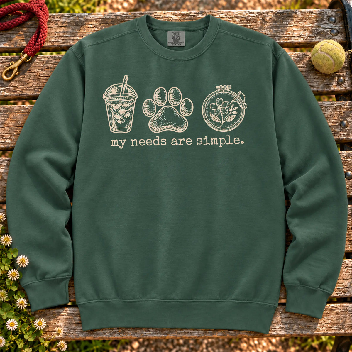 My Needs Are Simple coffee, dogs, and embroidery design on a Blue Spruce Comfort Colors sweatshirt