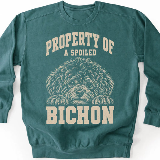 Blue Spruce Bichon Frise sweatshirt with a dog portrait and “Property of a Spoiled” lettering.
