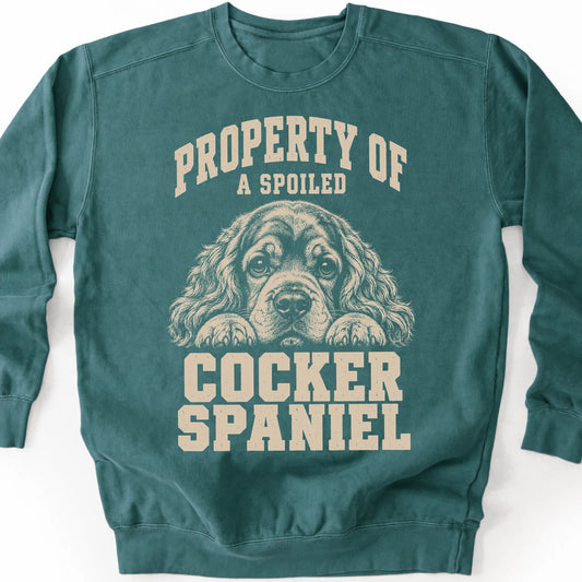 Blue Spruce Cocker Spaniel sweatshirt with a dog portrait and “Property of a Spoiled” lettering.