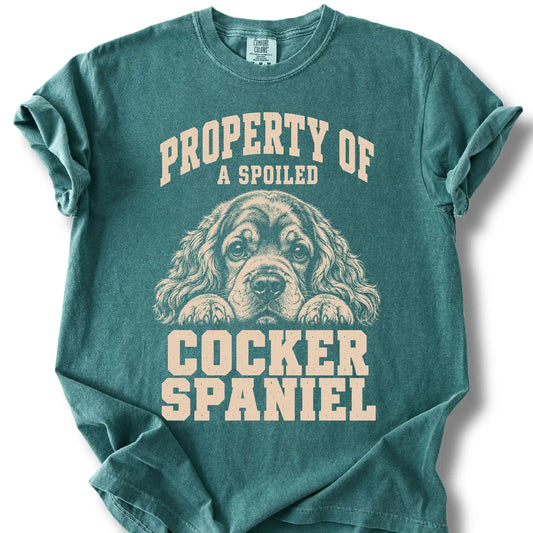 Blue Spruce Cocker Spaniel T-shirt with a dog portrait and “Property of a Spoiled” lettering.
