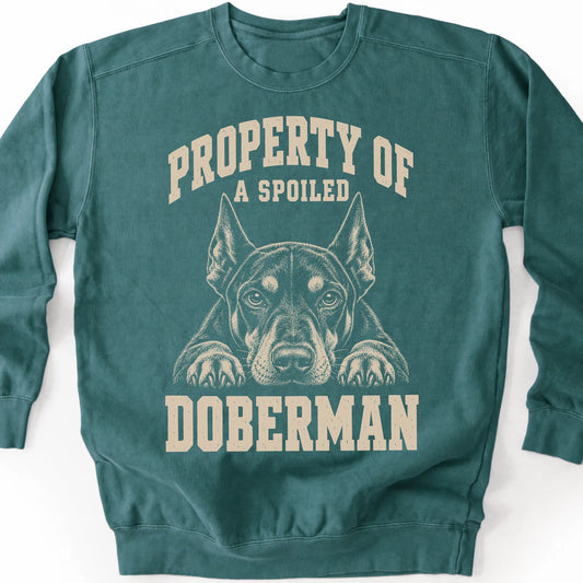 Blue Spruce Doberman sweatshirt with a dog portrait and “Property of a Spoiled” lettering.