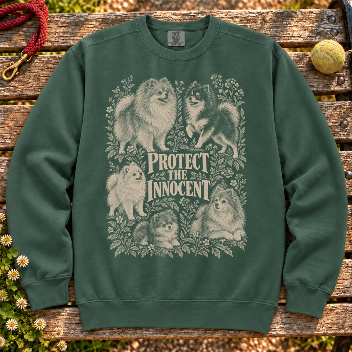 Protect the Innocent Pomeranian design on a Blue Spruce sweatshirt