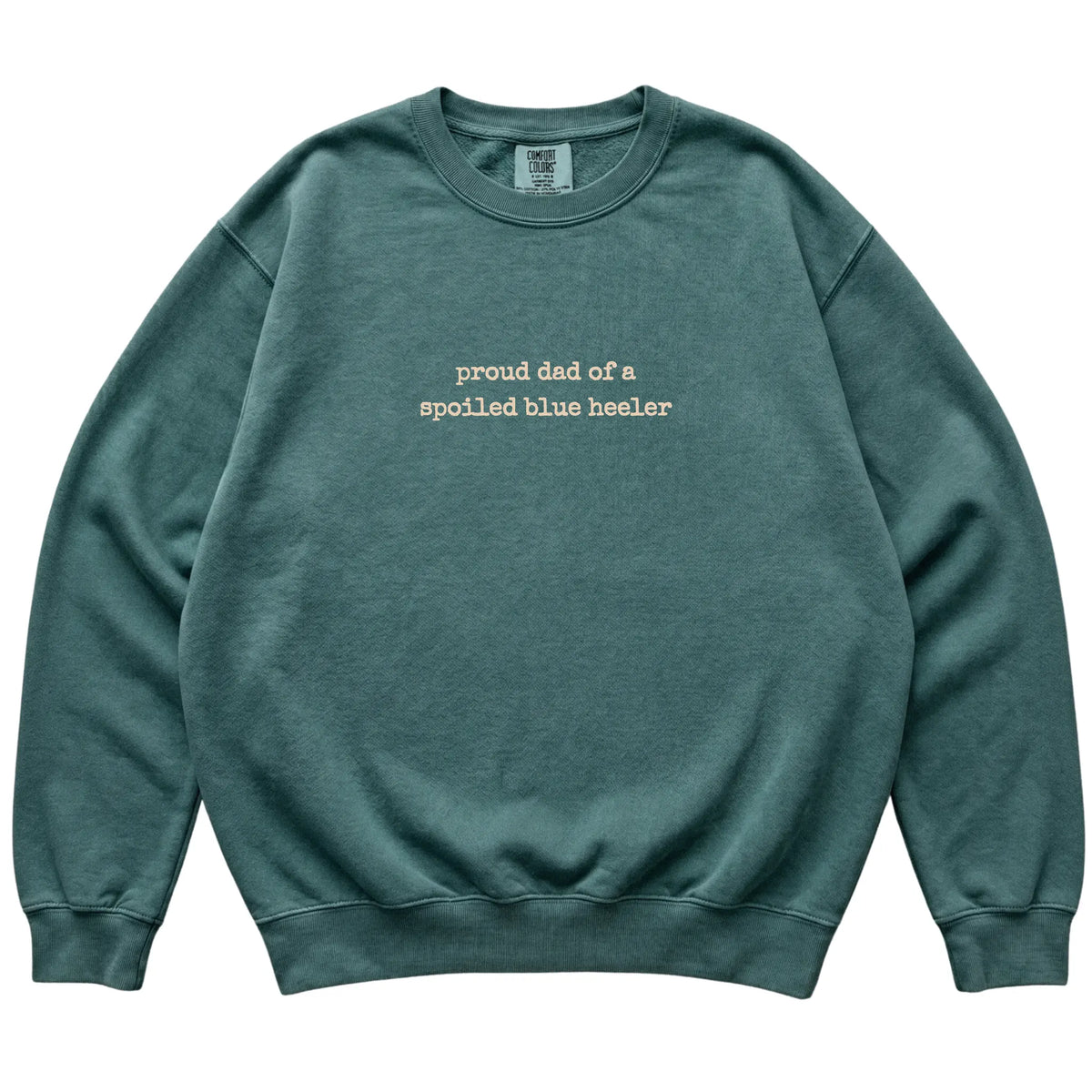 Blue Spruce Proud Dad of a Spoiled Blue Heeler Comfort Colors sweatshirt laid flat
