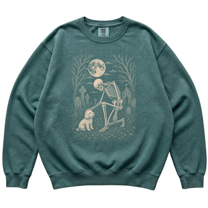 Skeleton petting a Bichon Frise in a graveyard on a Blue Spruce sweatshirt