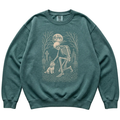 Skeleton petting a Havanese in a graveyard on a Blue Spruce sweatshirt