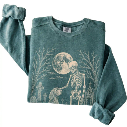 Folded Blue Spruce sweatshirt with a skeleton petting an Irish Setter in a graveyard