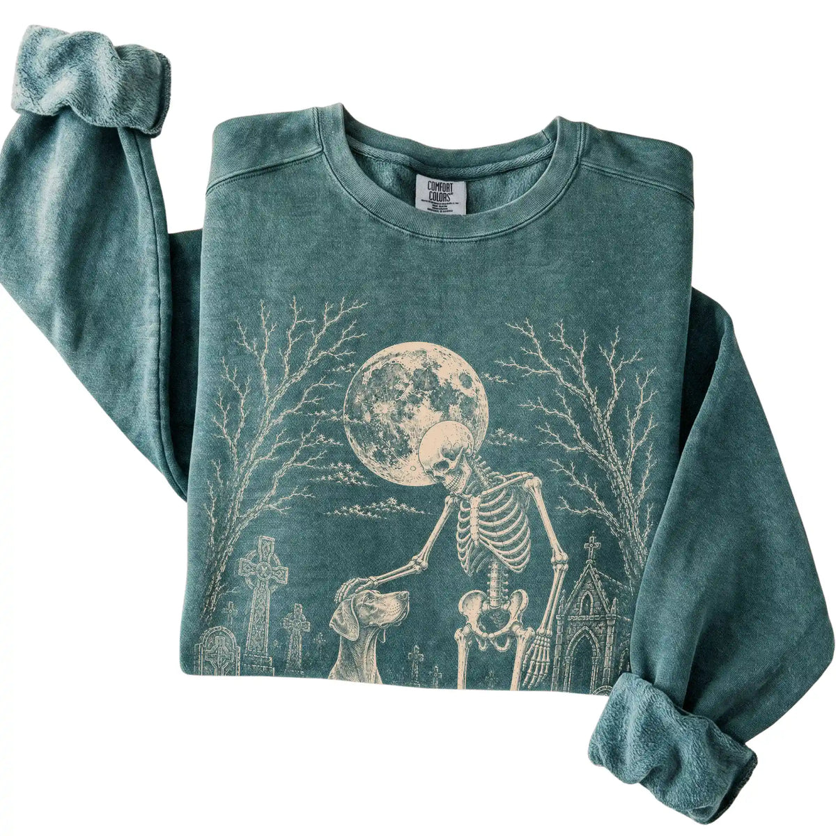 Folded Blue Spruce sweatshirt with a skeleton petting a Weimaraner in a graveyard