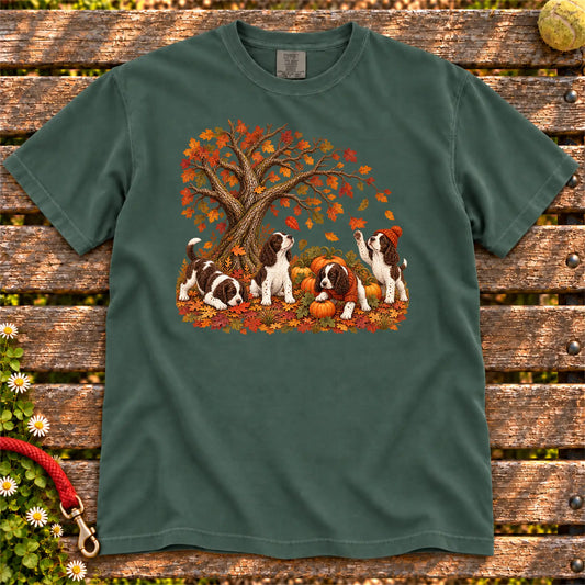 Four Springer Spaniel puppies with pumpkins beneath an autumn tree on a Blue Spruce garment-dyed T-shirt