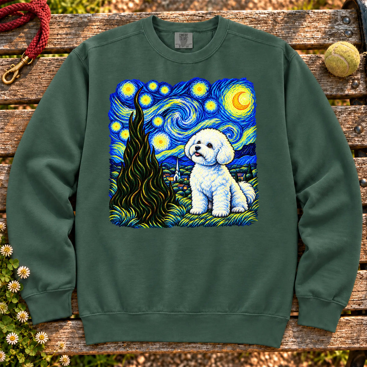 Colorful Bichon Frise beneath a swirling starry night sky on a Blue Spruce sweatshirt