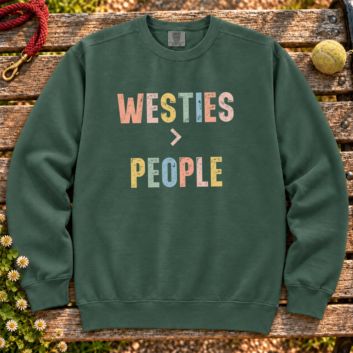 Westies greater than people text design on a Blue Spruce Comfort Colors sweatshirt