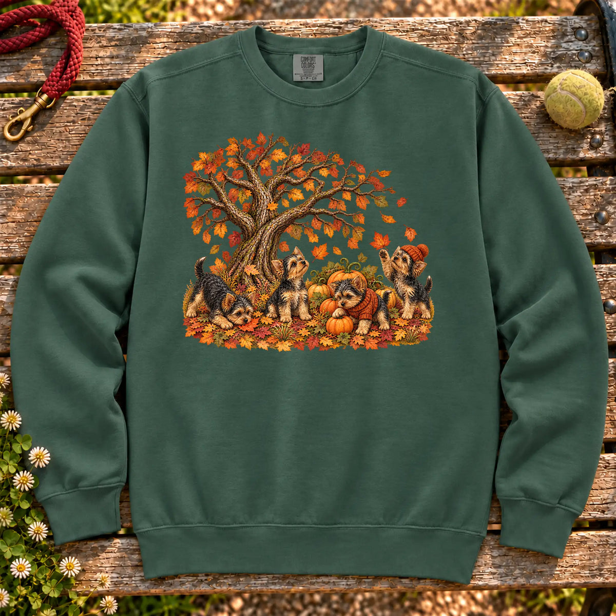 Four Yorkie puppies with pumpkins beneath an autumn tree on a Blue Spruce garment-dyed sweatshirt