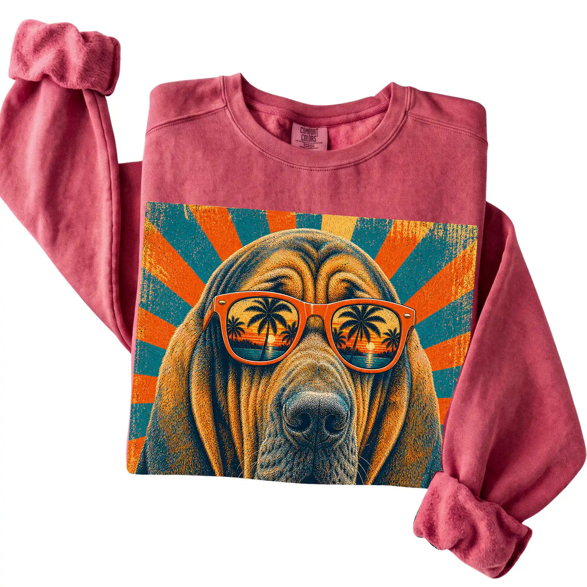 Folded Crimson Comfort Colors sweatshirt with a Retro Bloodhound Dad design
