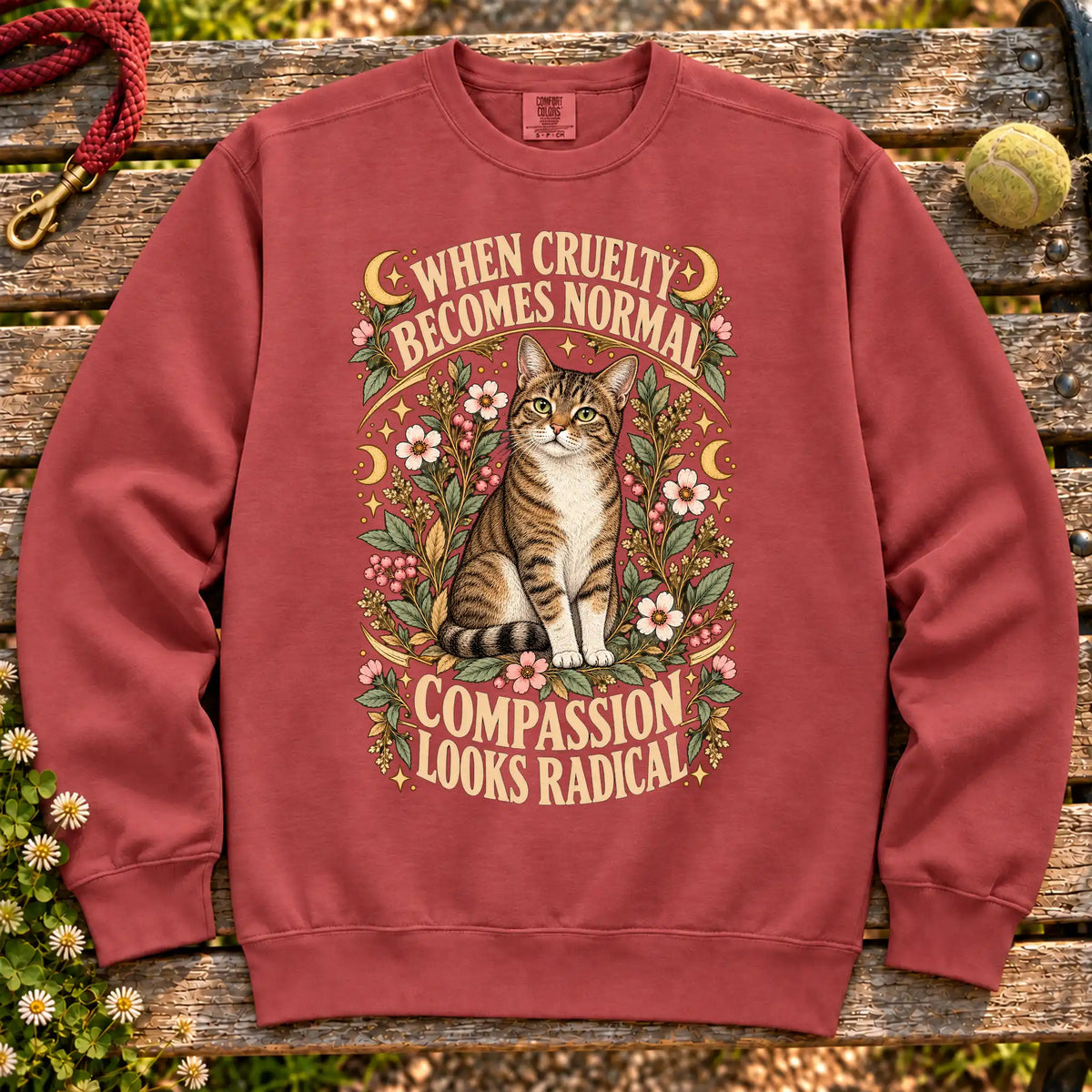 Compassion Looks Radical Rescue Cat design on a Crimson Comfort Colors sweatshirt