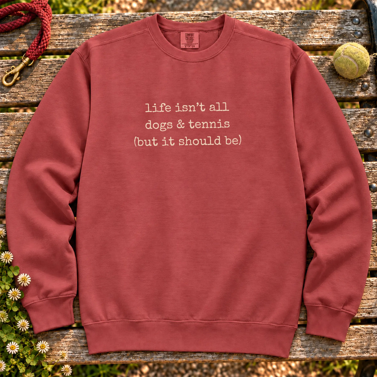 Dogs & Tennis design on a Crimson crewneck sweatshirt, shown flat