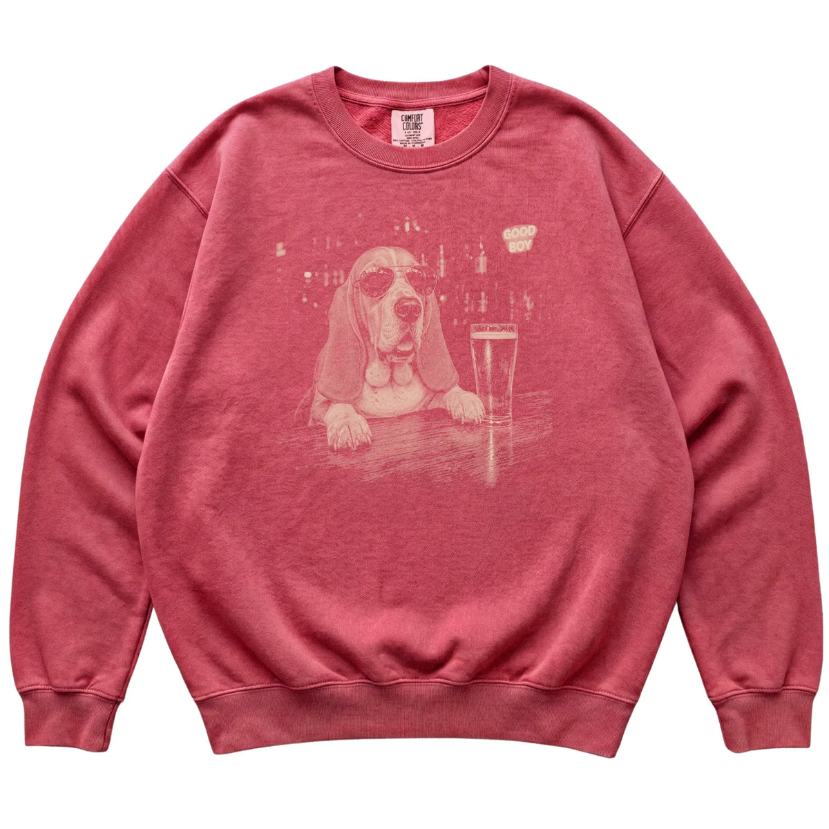 Crimson Basset Hound at a bar beside a pint, laid flat