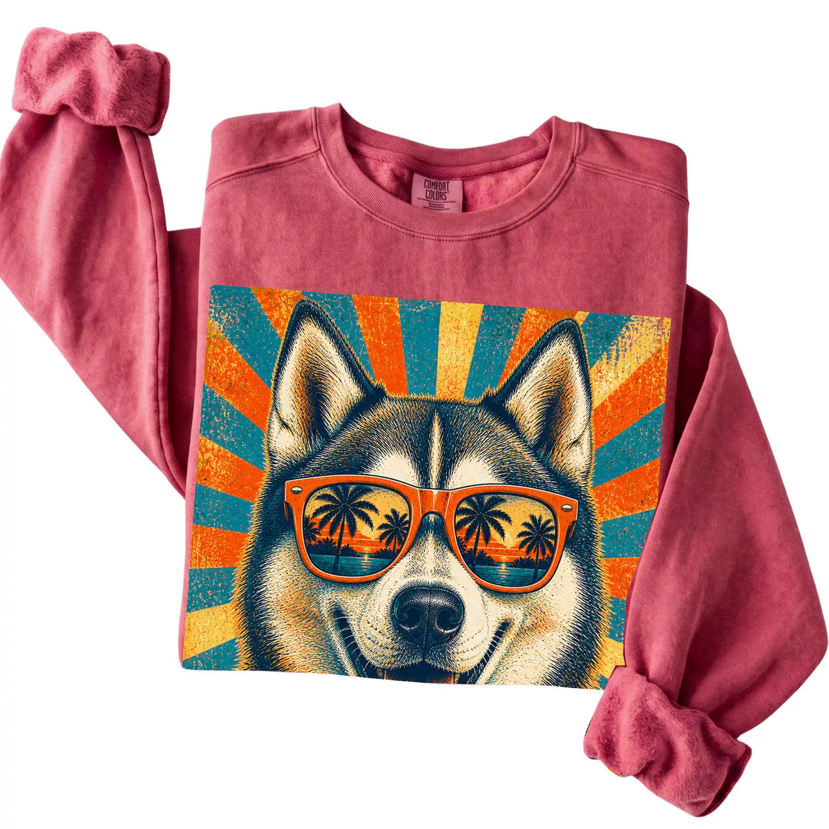 Folded Crimson Comfort Colors sweatshirt with a Retro Husky Dad design