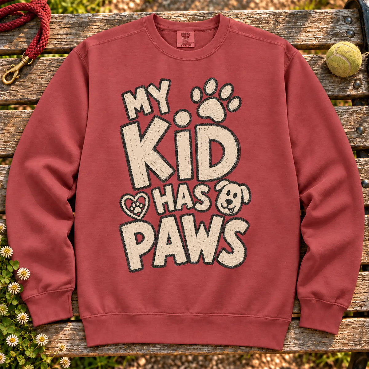 My kid has paws on a Crimson crewneck sweatshirt, shown flat