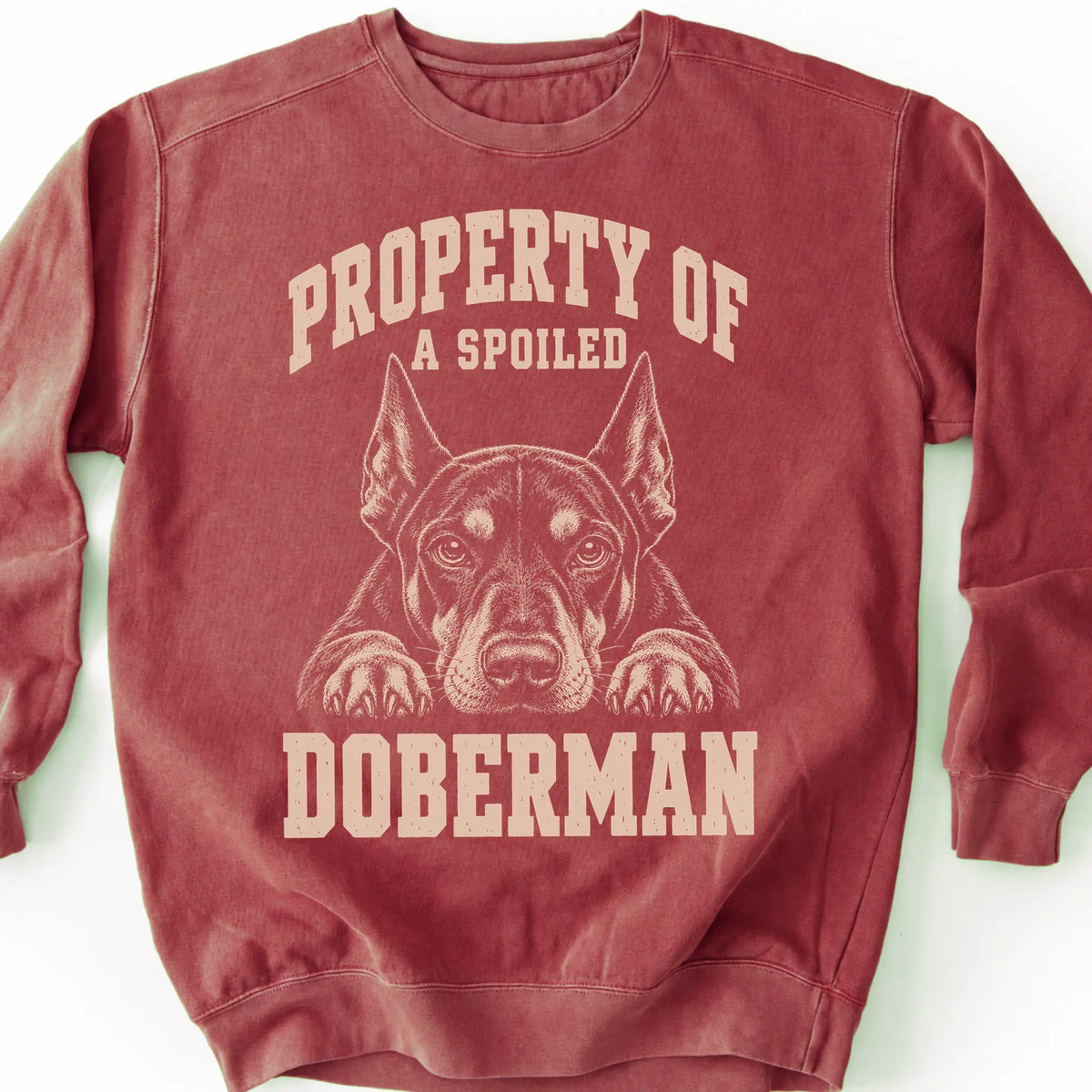 Crimson Doberman sweatshirt with a dog portrait and “Property of a Spoiled” lettering.