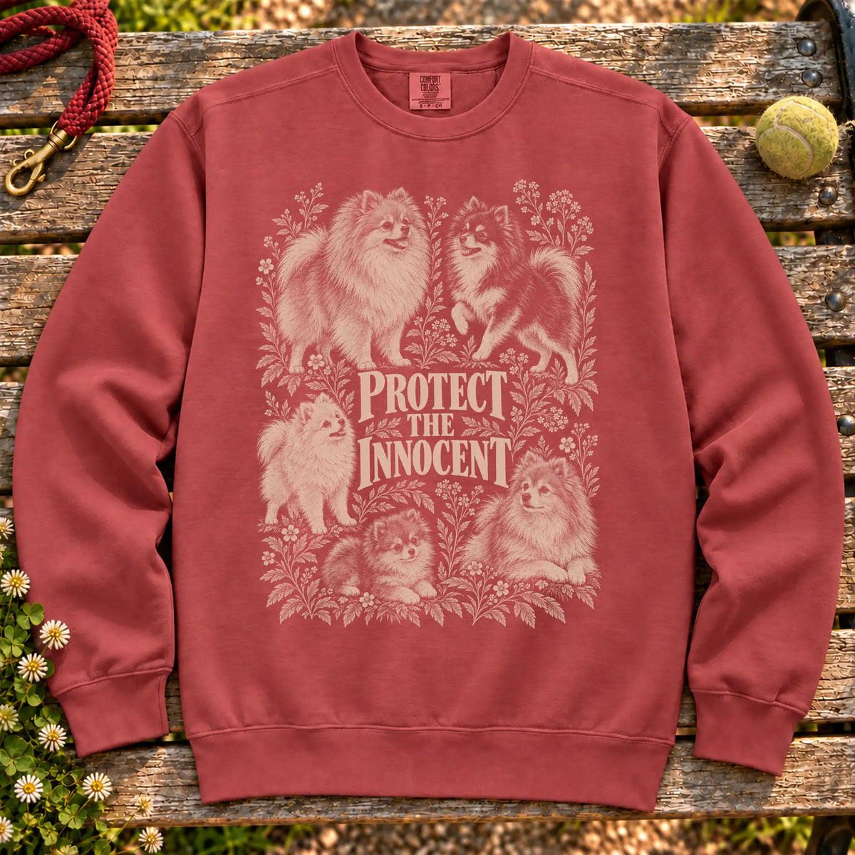 Protect the Innocent Pomeranian design on a Crimson sweatshirt