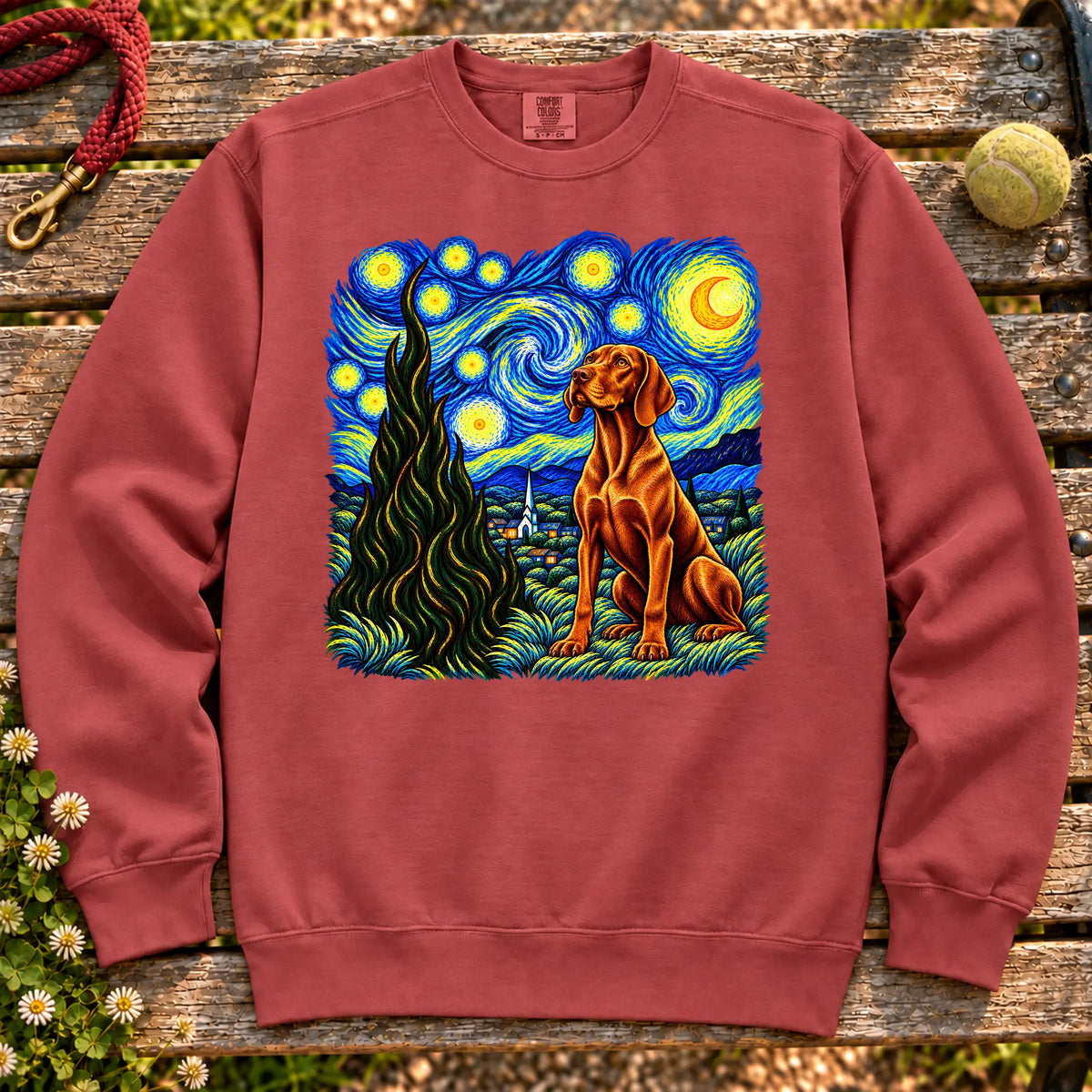 Colorful Vizsla beneath a swirling starry night sky on a Crimson sweatshirt