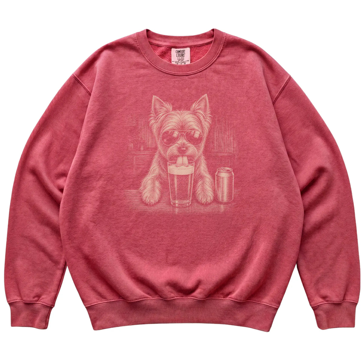 Crimson Yorkie drinking from a pint at a bar, laid flat