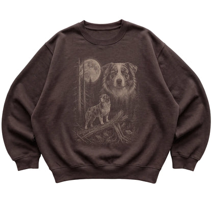 Australian Shepherd Moonlit Forest graphic on a dark chocolate crewneck sweatshirt laid flat