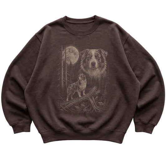 Australian Shepherd Moonlit Forest graphic on a dark chocolate crewneck sweatshirt laid flat