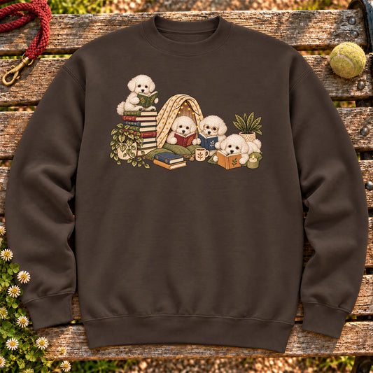 Bichon Frise puppies reading books in a cozy blanket fort on a Dark Chocolate sweatshirt