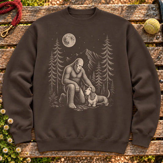 Basset Hound Bigfoot Petting on a Dark Chocolate crewneck sweatshirt, shown flat