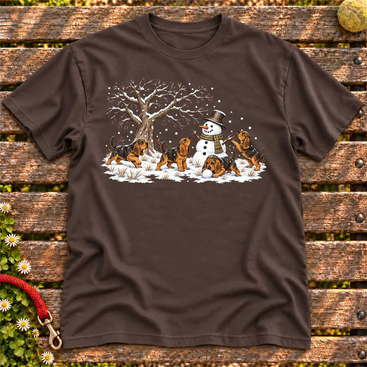Bloodhound puppies playing in snow with a snowman on a Dark Chocolate T-shirt