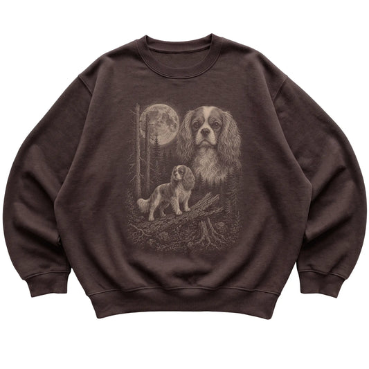 Cavalier King Charles Spaniel Moonlit Forest graphic on a dark chocolate crewneck sweatshirt laid flat