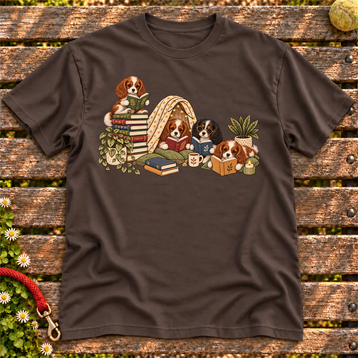 Cavalier King Charles Spaniel puppies reading books in a cozy blanket fort on a Dark Chocolate T-shirt
