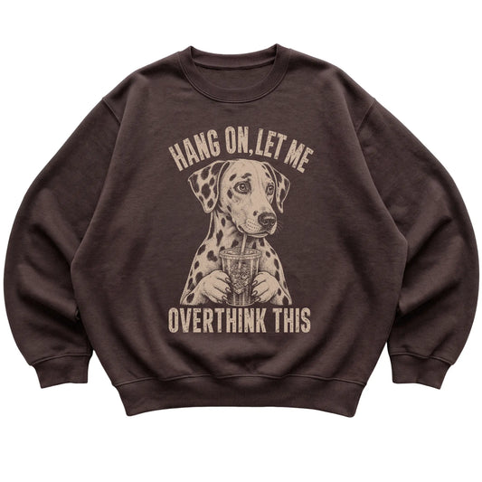 Dark Chocolate crewneck sweatshirt featuring Overthinking Dalmatian, laid-flat presentation