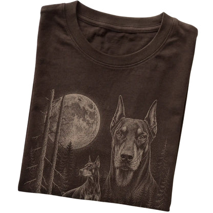 Folded dark chocolate Softstyle T-shirt showing the Doberman Moonlit Forest graphic