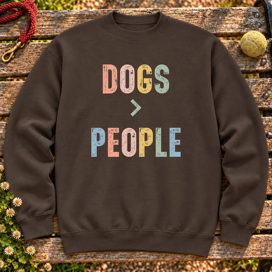Dogss greater than people text design on a Dark Chocolate crewneck sweatshirt