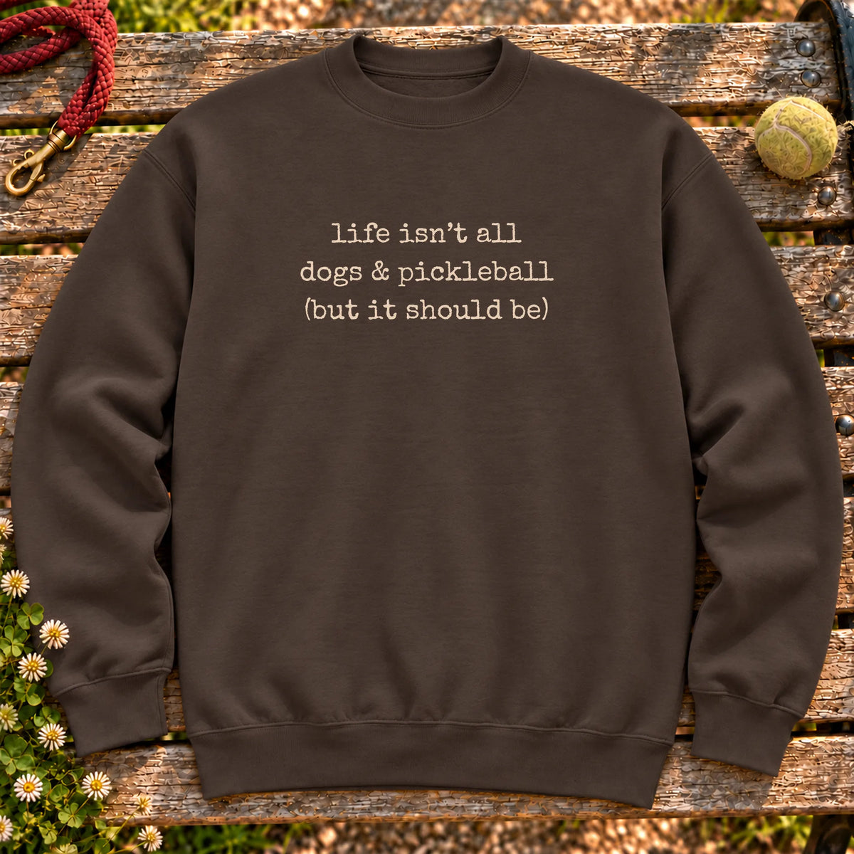 Dogs & Pickleball design on a Dark Chocolate crewneck sweatshirt, shown flat