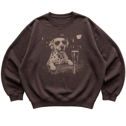 Dark Chocolate Dalmatian at a bar beside a pint, laid flat
