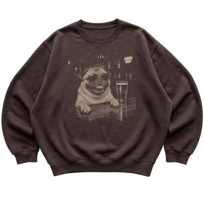 Dark Chocolate Pug at a bar beside a pint, laid flat