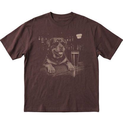 Dark Chocolate Rottweiler at a bar beside a pint, laid flat