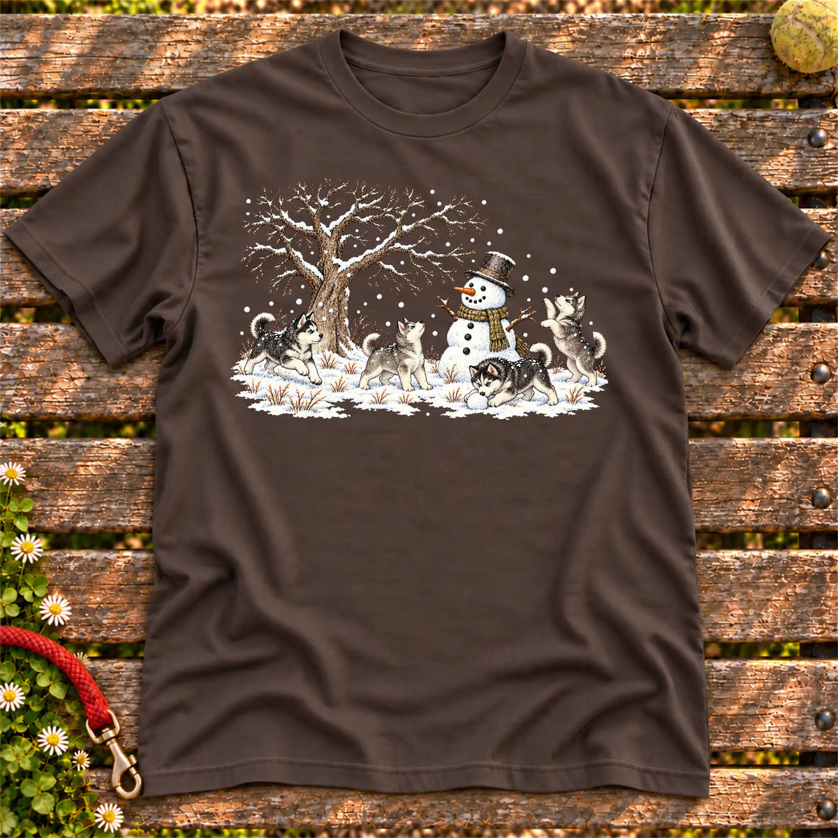 Husky puppies playing in snow with a snowman on a Dark Chocolate T-shirt