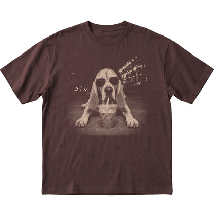 Bloodhound wearing aviator sunglasses and drinking iced coffee on a Dark Chocolate Gildan Softstyle T-Shirt, flat lay view